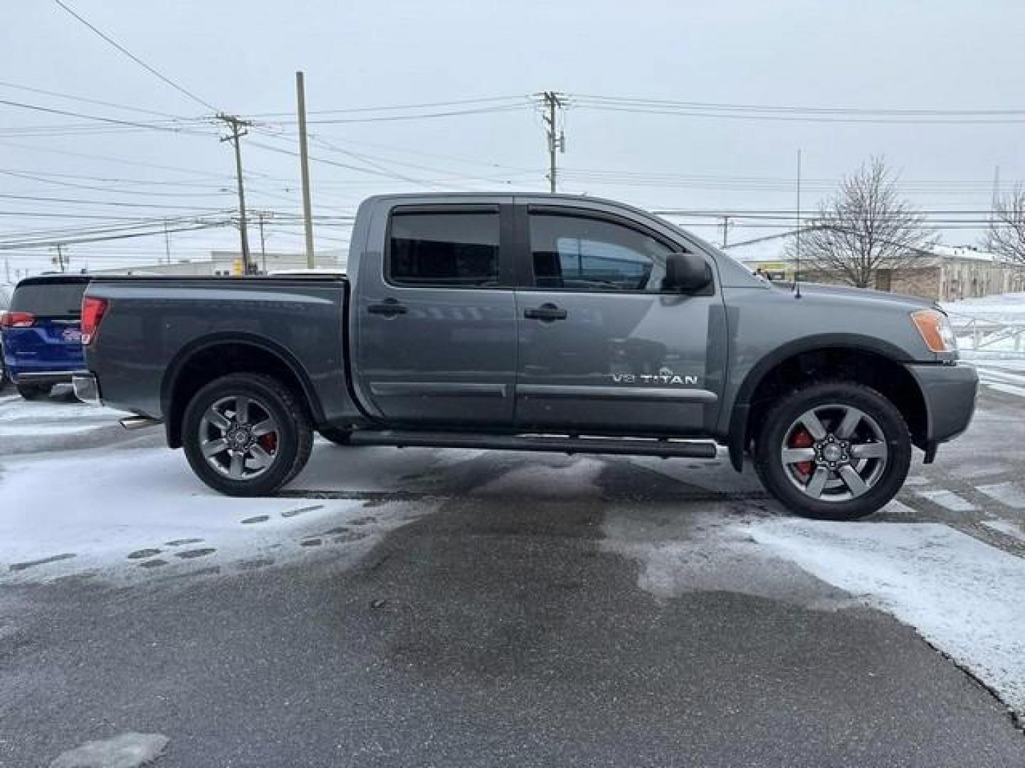 2015 GREY NISSAN TITAN (1N6AA0EC0FN) with an V8,5.6L(339 CID),DOHC engine, AUTOMATIC transmission, located at 14600 Frazho Road, Warren, MI, 48089, (586) 776-3400, 42.485996, -82.974220 - Photo#3