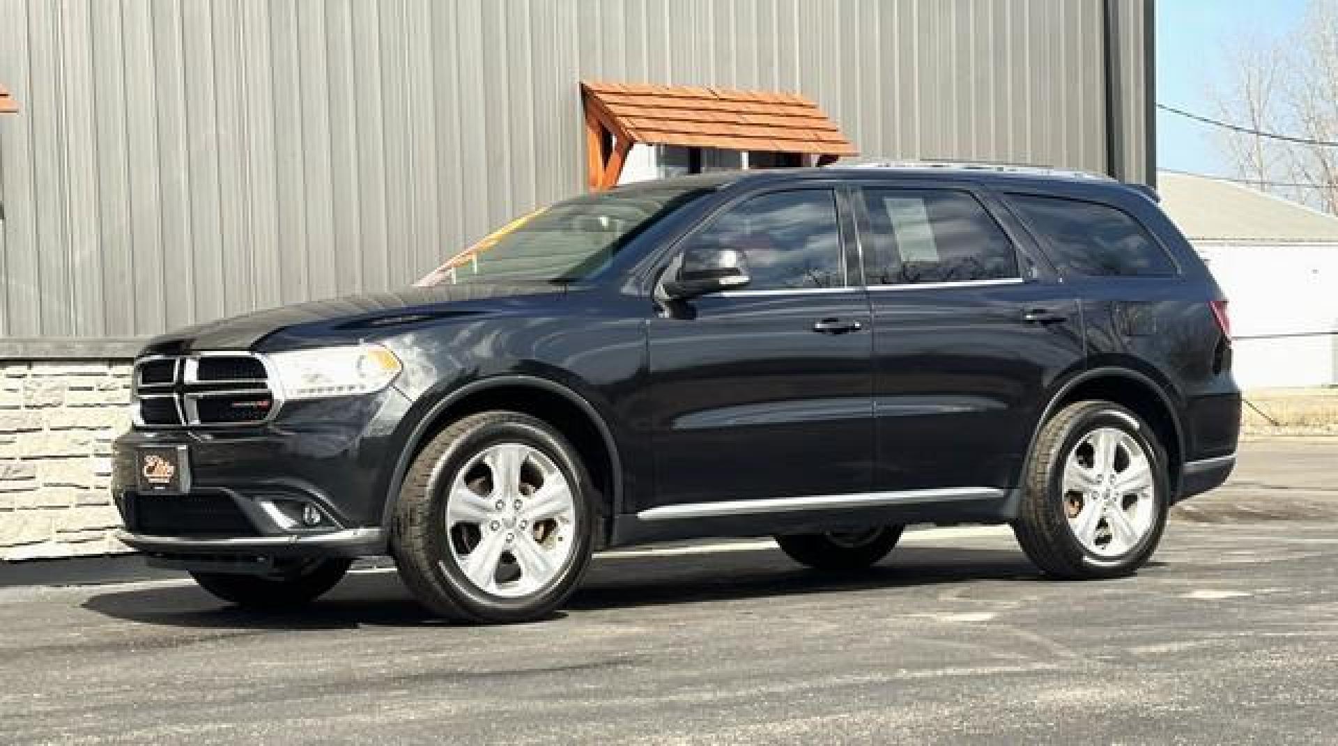 2015 BLACK DODGE DURANGO (1C4RDJDG7FC) with an V6,3.6L(220 CID),DOHC engine, AUTOMATIC transmission, located at 14600 Frazho Road, Warren, MI, 48089, (586) 776-3400, 42.485996, -82.974220 - Photo#1