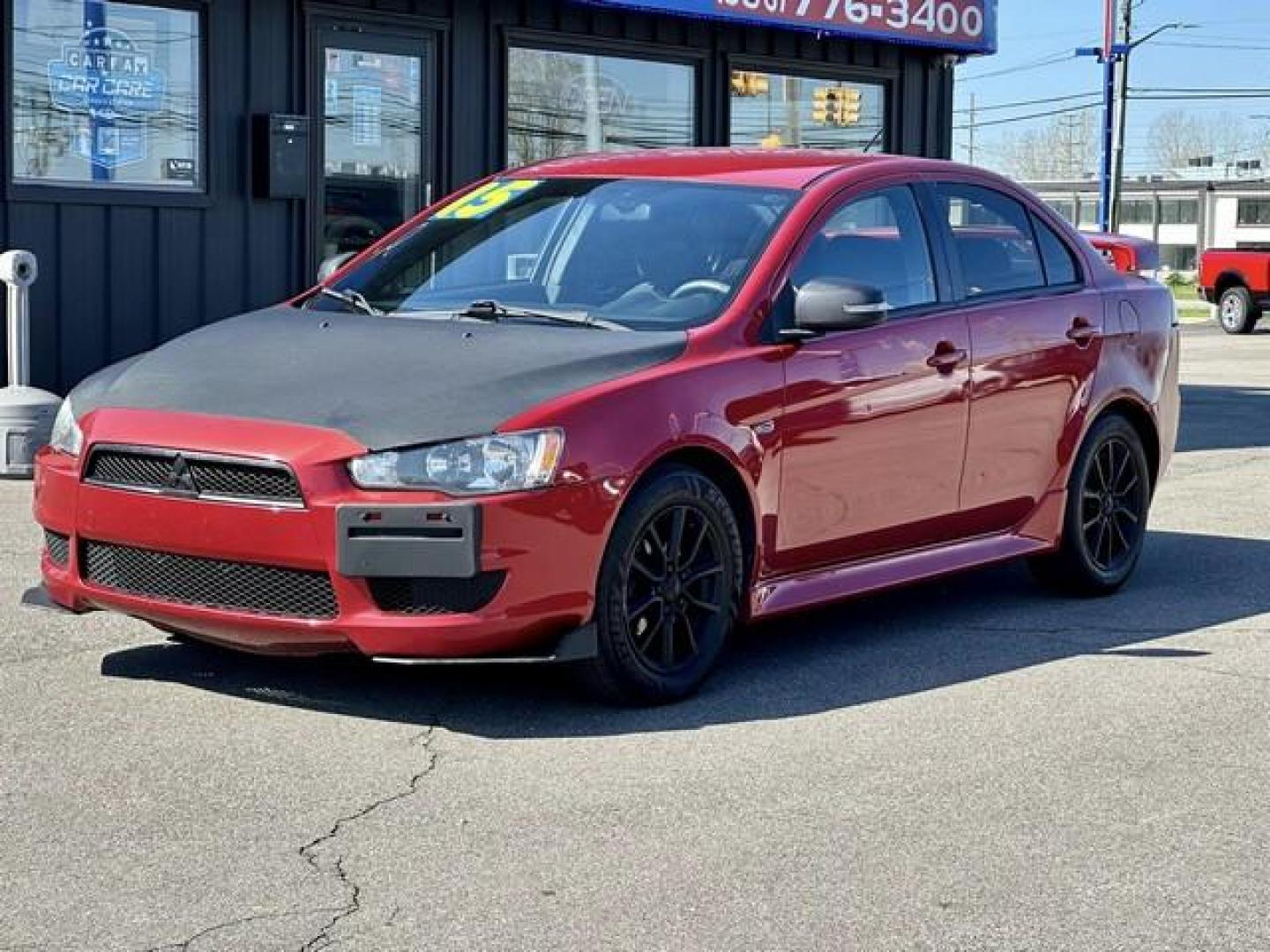 2015 RED MITSUBISHI LANCER (JA32U2FU7FU) with an L4,2.0L(122 CID),DOHC engine, AUTOMATIC transmission, located at 14600 Frazho Road, Warren, MI, 48089, (586) 776-3400, 42.485996, -82.974220 - Photo#0