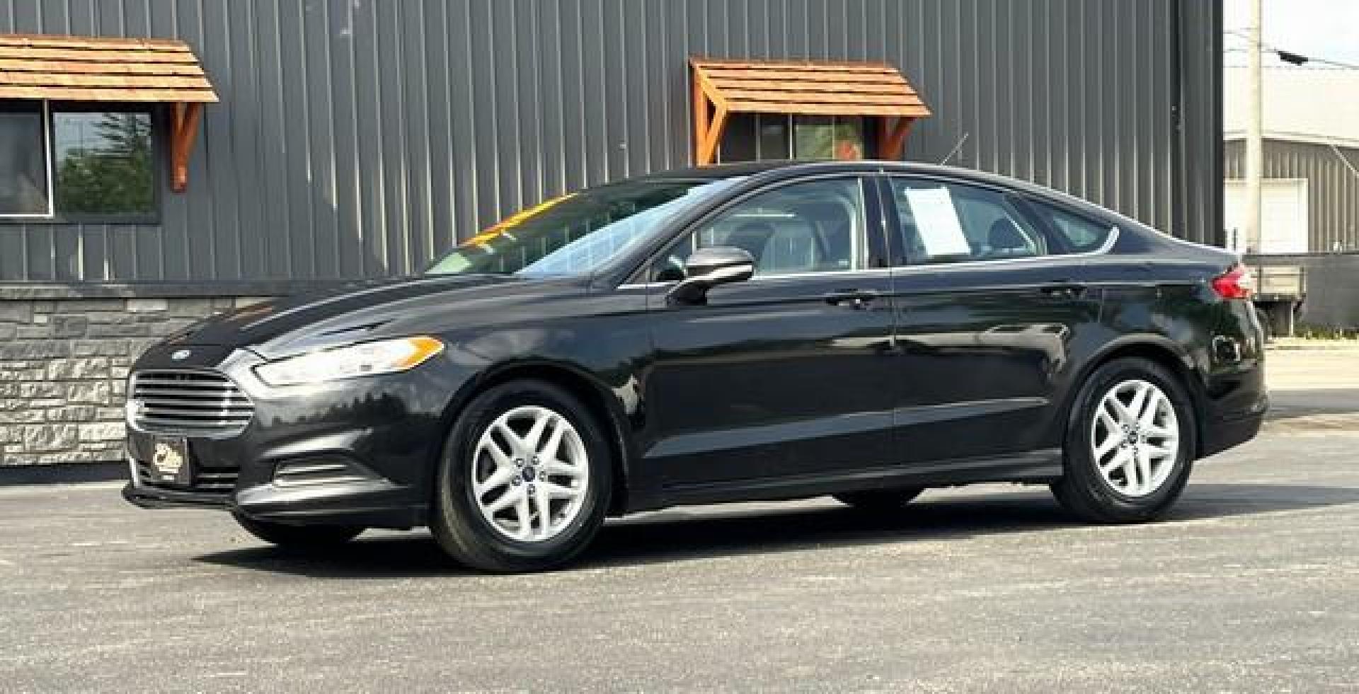 2015 BLACK FORD FUSION (1FA6P0H74F5) with an L4,2.5L(152 CID),DOHC engine, AUTOMATIC transmission, located at 14600 Frazho Road, Warren, MI, 48089, (586) 776-3400, 42.485996, -82.974220 - Photo#2