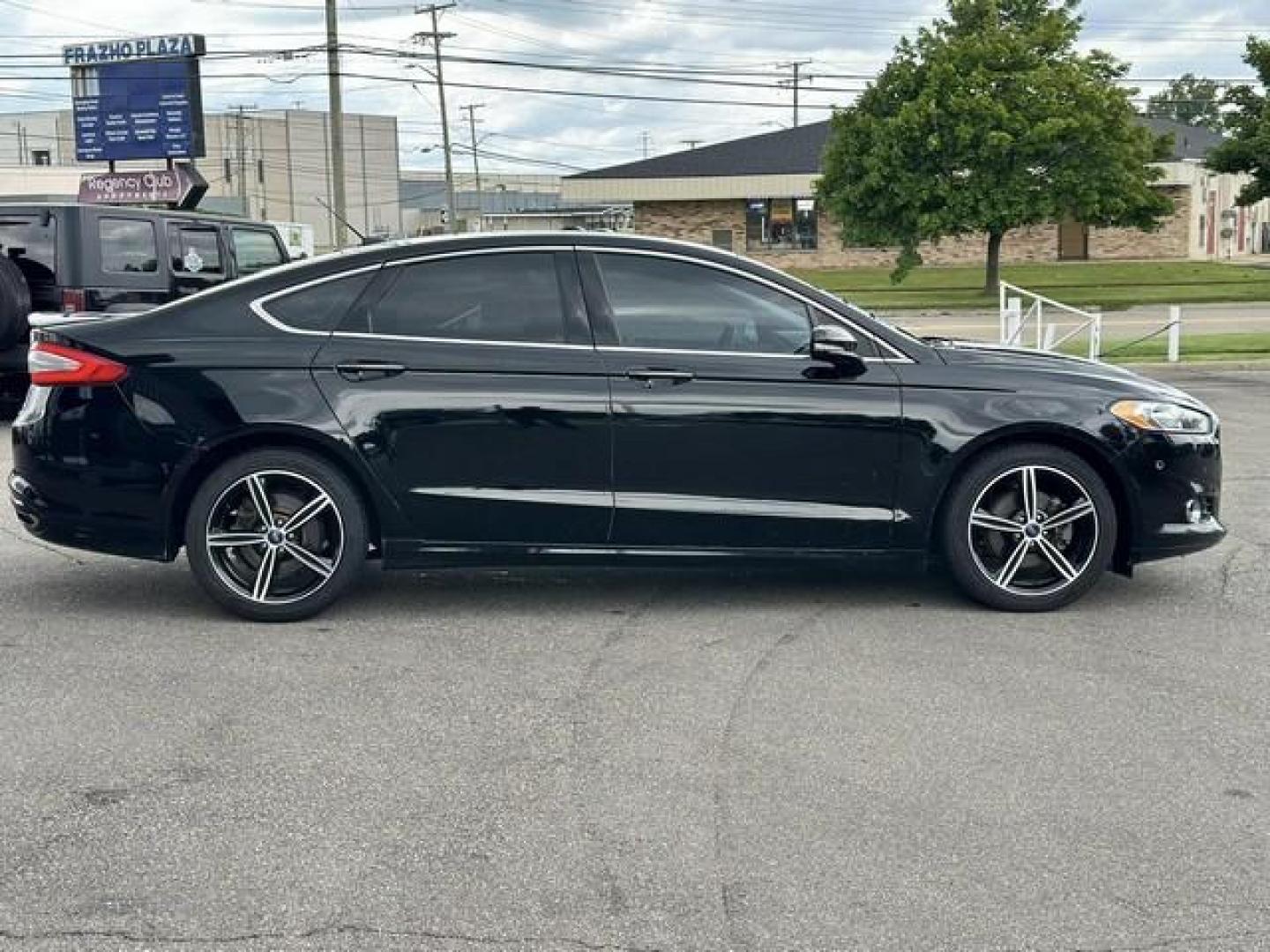 2016 BLACK FORD FUSION (3FA6P0D99GR) with an L4,2.0L(122 CID),DOHC engine, AUTOMATIC transmission, located at 14600 Frazho Road, Warren, MI, 48089, (586) 776-3400, 42.485996, -82.974220 - Photo#3