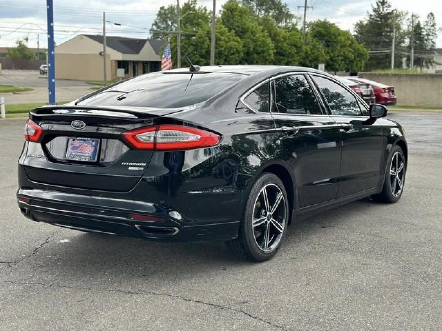 2016 BLACK FORD FUSION (3FA6P0D99GR) with an L4,2.0L(122 CID),DOHC engine, AUTOMATIC transmission, located at 14600 Frazho Road, Warren, MI, 48089, (586) 776-3400, 42.485996, -82.974220 - Photo#4