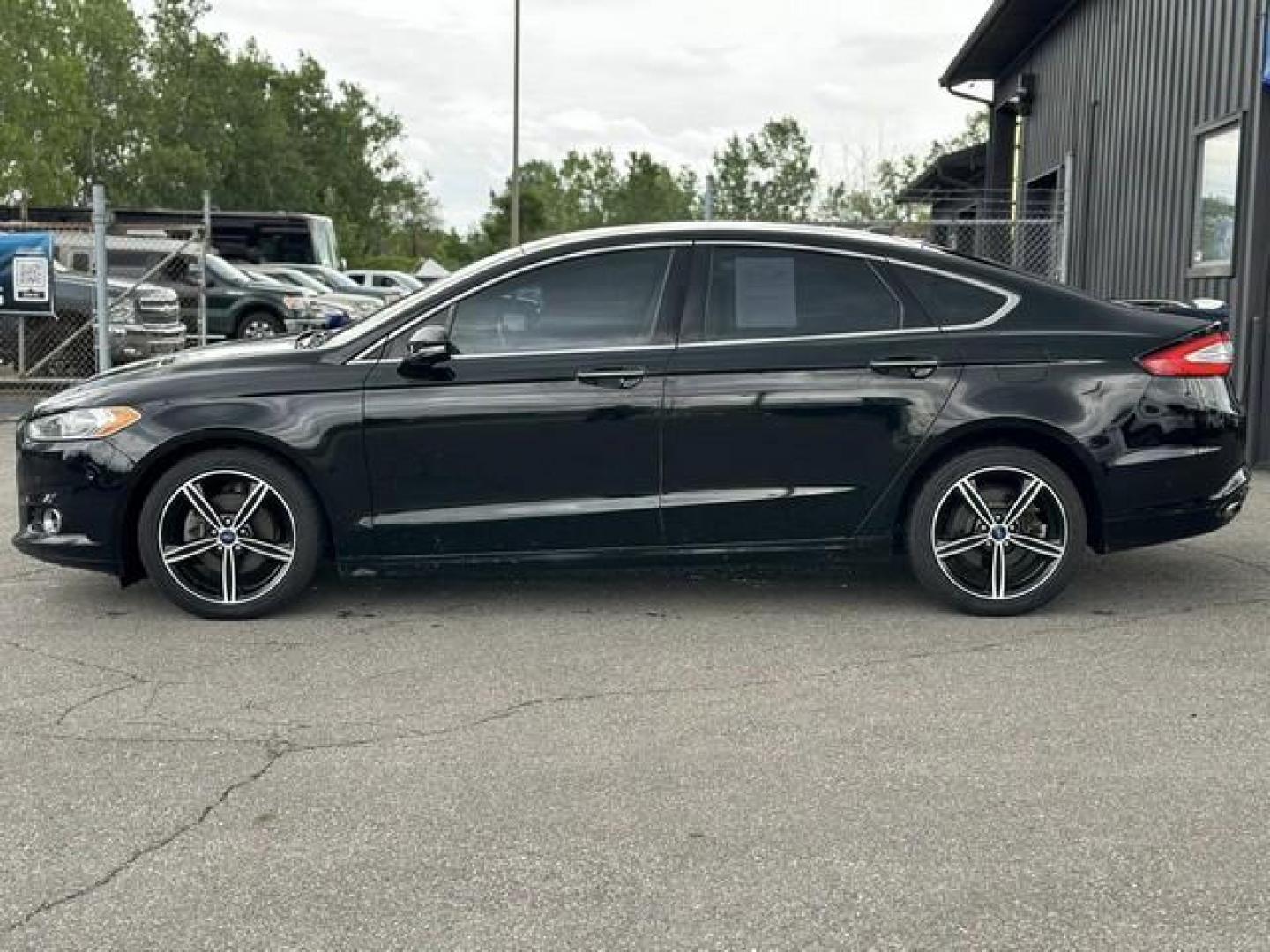 2016 BLACK FORD FUSION (3FA6P0D99GR) with an L4,2.0L(122 CID),DOHC engine, AUTOMATIC transmission, located at 14600 Frazho Road, Warren, MI, 48089, (586) 776-3400, 42.485996, -82.974220 - Photo#7