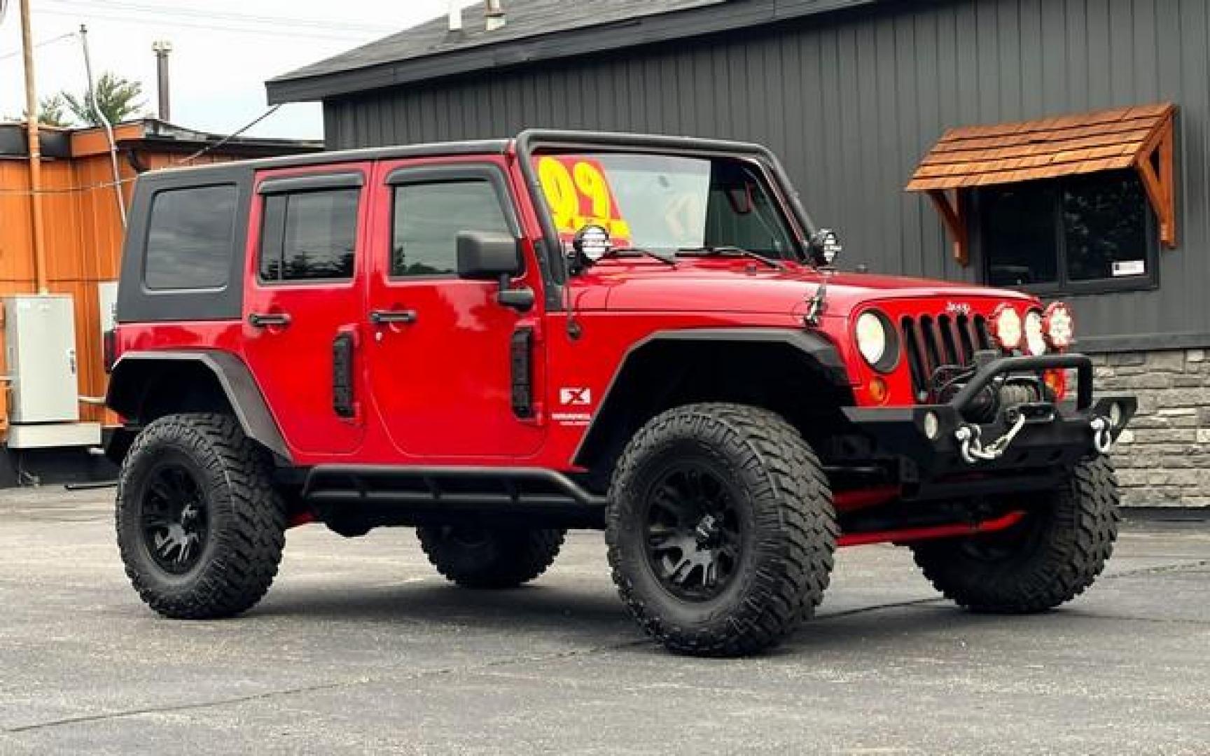 2009 RED JEEP WRANGLER (1J4GA39179L) with an V6,3.8L(231 CID),OHV engine, MANUAL transmission, located at 14600 Frazho Road, Warren, MI, 48089, (586) 776-3400, 42.485996, -82.974220 - Photo#1