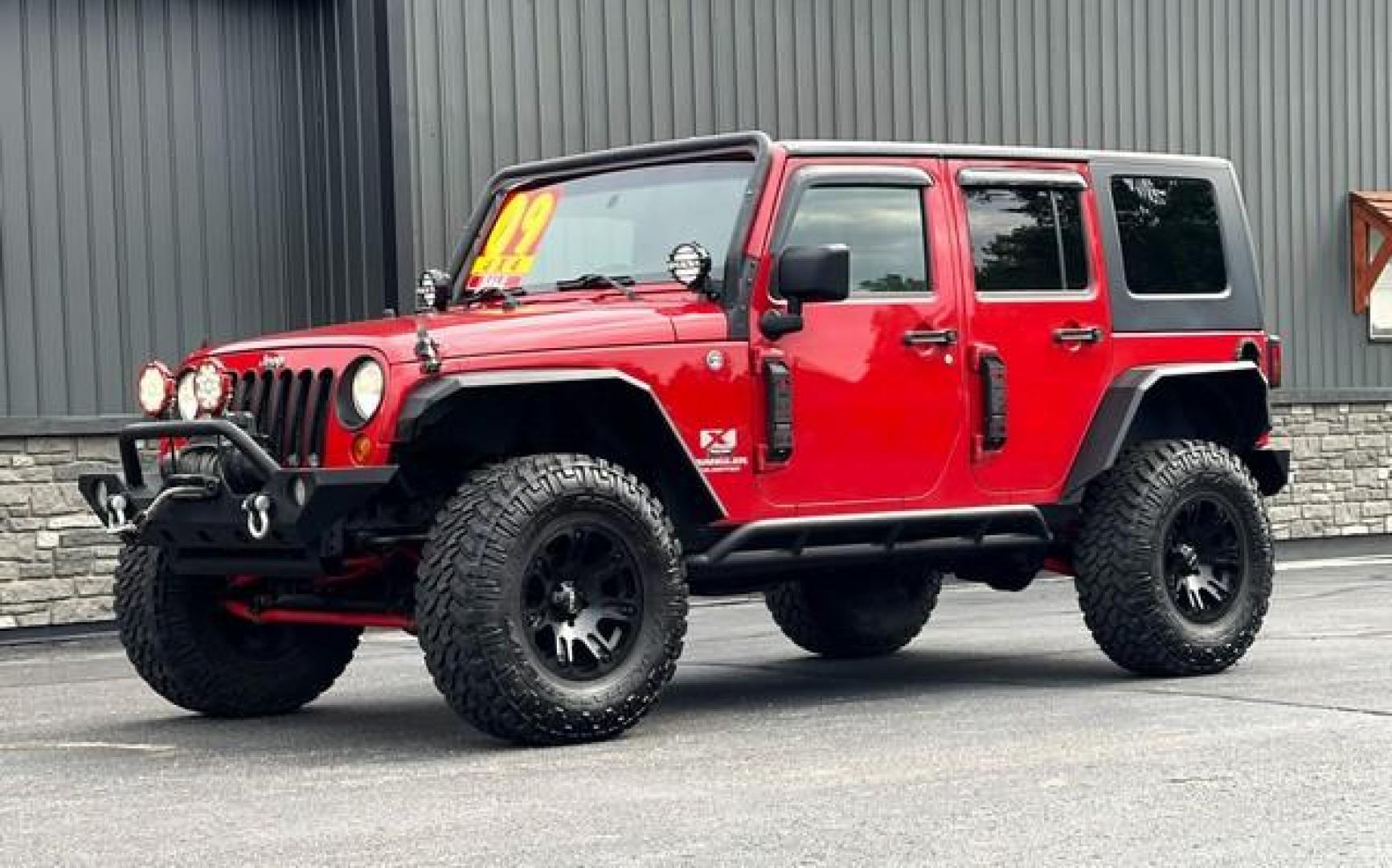 2009 RED JEEP WRANGLER (1J4GA39179L) with an V6,3.8L(231 CID),OHV engine, MANUAL transmission, located at 14600 Frazho Road, Warren, MI, 48089, (586) 776-3400, 42.485996, -82.974220 - Photo#4