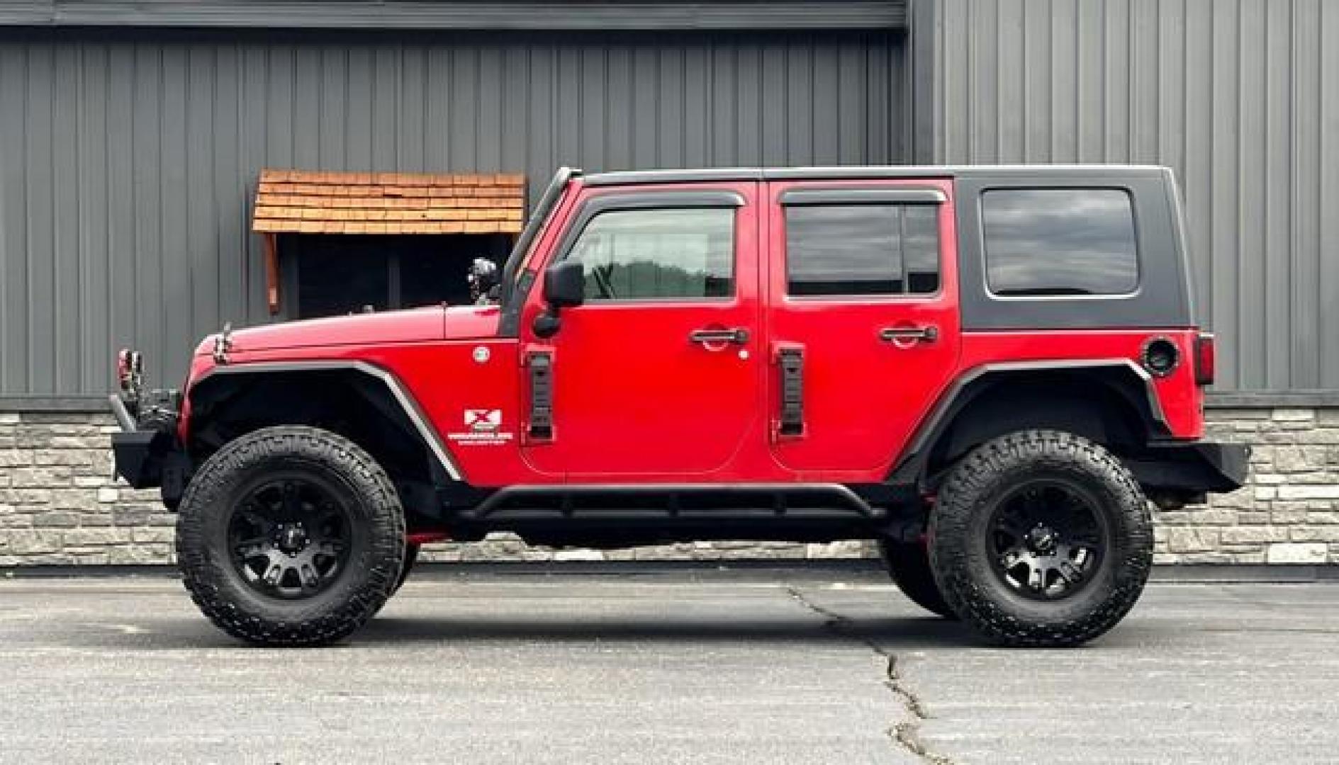 2009 RED JEEP WRANGLER (1J4GA39179L) with an V6,3.8L(231 CID),OHV engine, MANUAL transmission, located at 14600 Frazho Road, Warren, MI, 48089, (586) 776-3400, 42.485996, -82.974220 - Photo#5