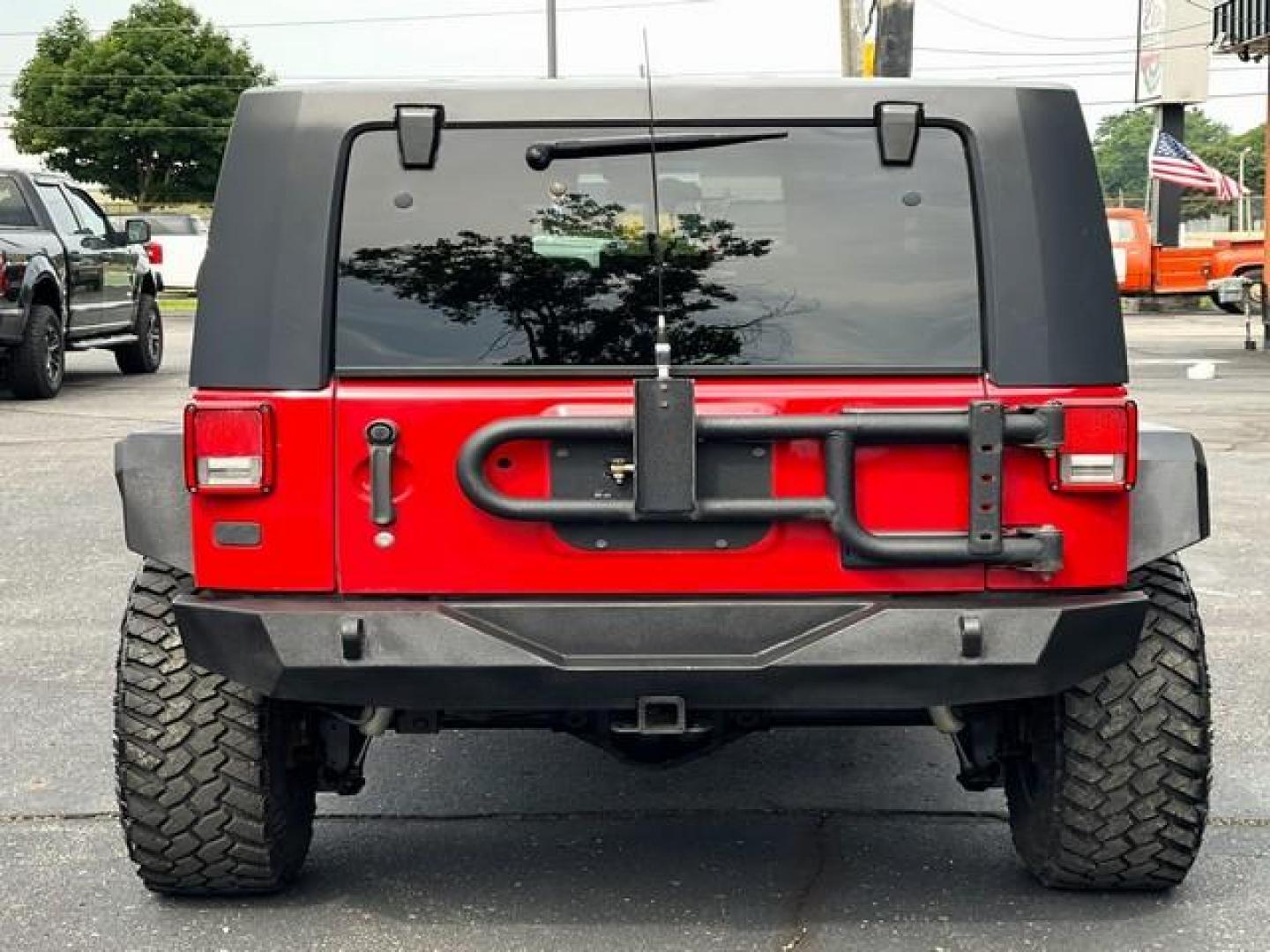 2009 RED JEEP WRANGLER (1J4GA39179L) with an V6,3.8L(231 CID),OHV engine, MANUAL transmission, located at 14600 Frazho Road, Warren, MI, 48089, (586) 776-3400, 42.485996, -82.974220 - Photo#6