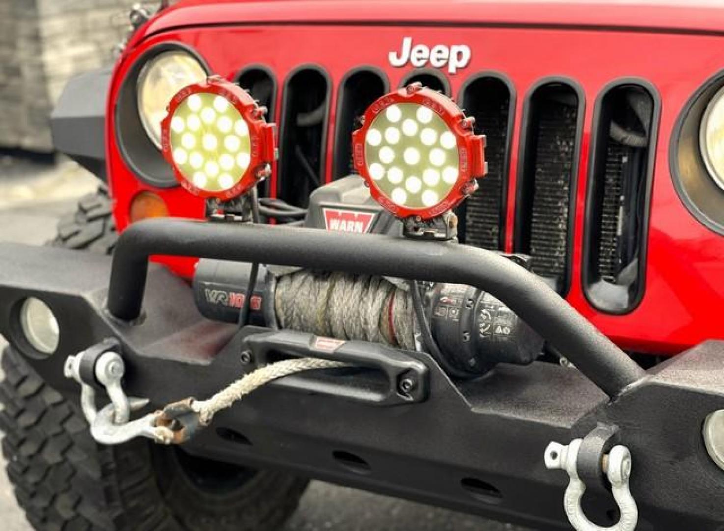 2009 RED JEEP WRANGLER (1J4GA39179L) with an V6,3.8L(231 CID),OHV engine, MANUAL transmission, located at 14600 Frazho Road, Warren, MI, 48089, (586) 776-3400, 42.485996, -82.974220 - Photo#8