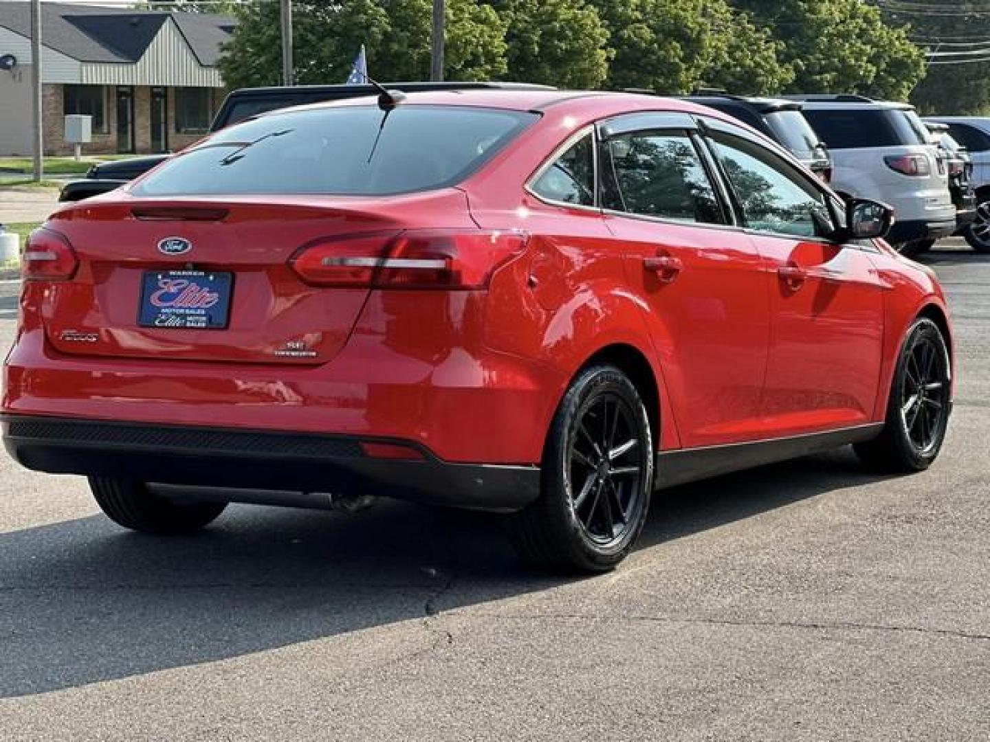 2015 RED FORD FOCUS (1FADP3F24FL) with an L4,2.0L(122 CID),DOHC engine, AUTOMATIC transmission, located at 14600 Frazho Road, Warren, MI, 48089, (586) 776-3400, 42.485996, -82.974220 - Photo#4