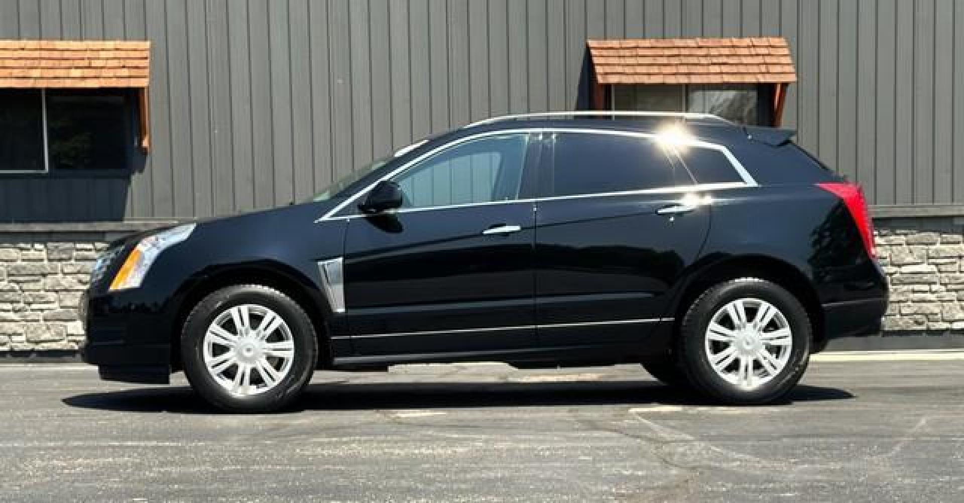 2014 BLACK CADILLAC SRX (3GYFNAE31ES) with an V6,3.6L(217 CID),DOHC engine, AUTOMATIC transmission, located at 14600 Frazho Road, Warren, MI, 48089, (586) 776-3400, 42.485996, -82.974220 - Photo#2