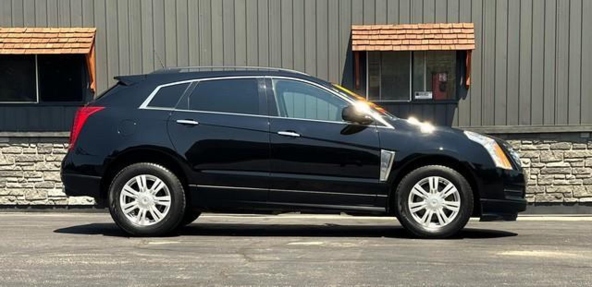 2014 BLACK CADILLAC SRX (3GYFNAE31ES) with an V6,3.6L(217 CID),DOHC engine, AUTOMATIC transmission, located at 14600 Frazho Road, Warren, MI, 48089, (586) 776-3400, 42.485996, -82.974220 - Photo#5