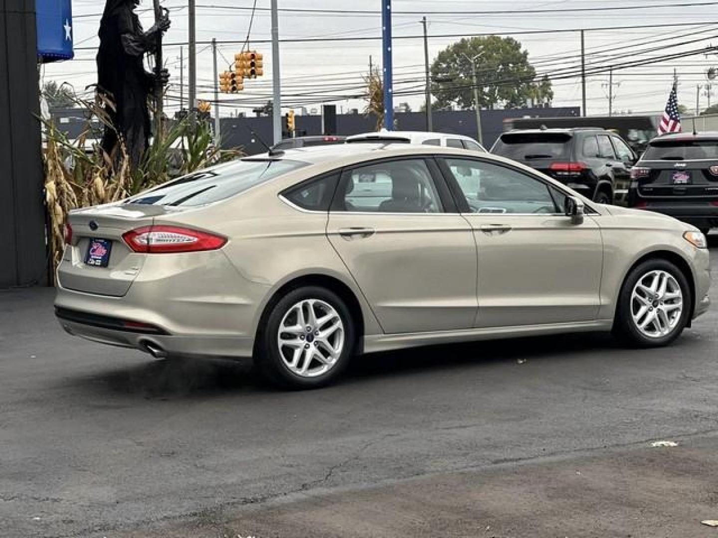 2015 TAN FORD FUSION (3FA6P0HD3FR) with an L4,1.5L(91 CID),DOHC engine, AUTOMATIC transmission, located at 14600 Frazho Road, Warren, MI, 48089, (586) 776-3400, 42.485996, -82.974220 - Photo#4