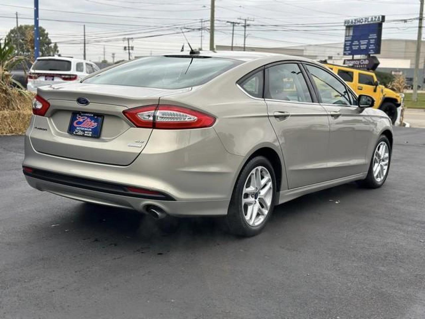 2015 TAN FORD FUSION (3FA6P0HD3FR) with an L4,1.5L(91 CID),DOHC engine, AUTOMATIC transmission, located at 14600 Frazho Road, Warren, MI, 48089, (586) 776-3400, 42.485996, -82.974220 - Photo#5