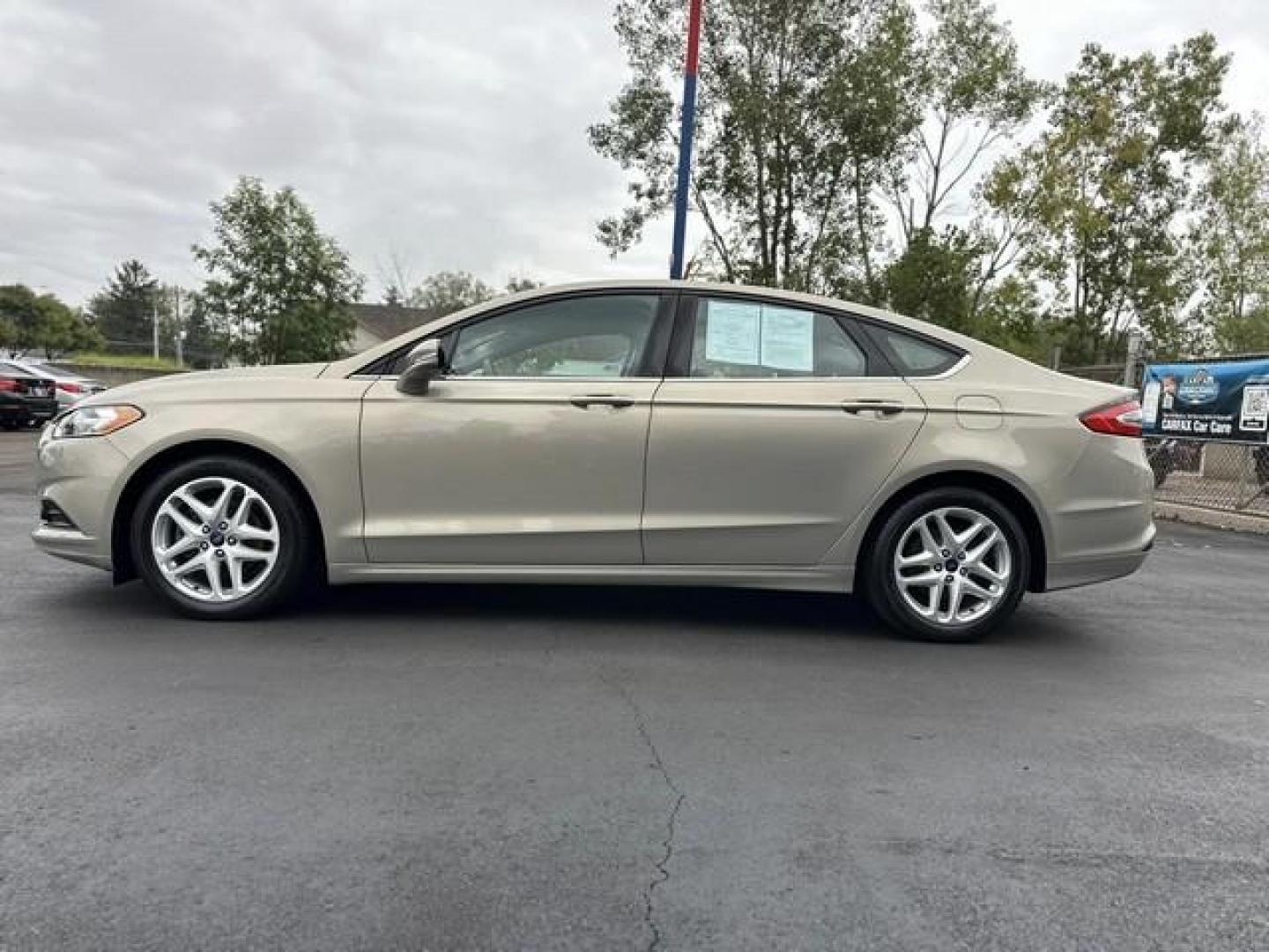 2015 TAN FORD FUSION (3FA6P0HD3FR) with an L4,1.5L(91 CID),DOHC engine, AUTOMATIC transmission, located at 14600 Frazho Road, Warren, MI, 48089, (586) 776-3400, 42.485996, -82.974220 - Photo#7