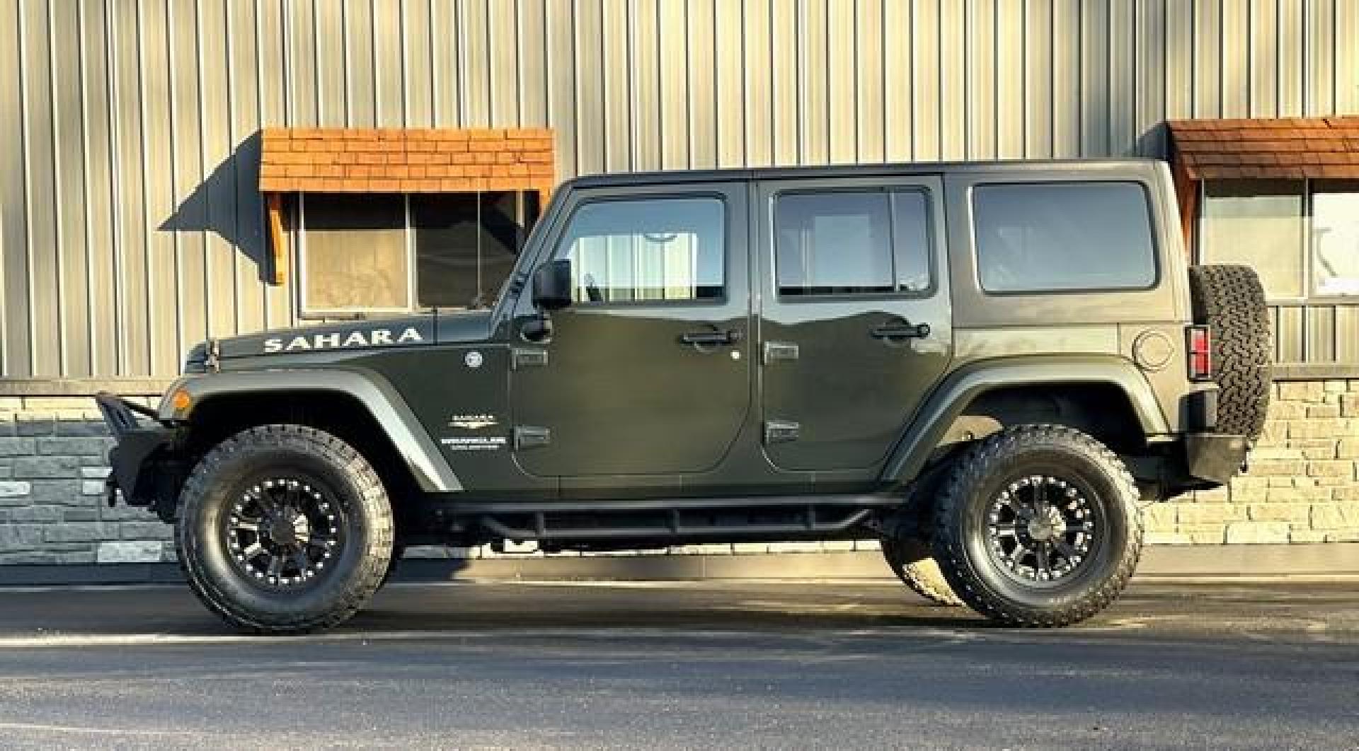 2015 GREEN JEEP WRANGLER (1C4BJWEG4FL) with an V6,3.6L(220 CID),DOHC engine, AUTOMATIC transmission, located at 14600 Frazho Road, Warren, MI, 48089, (586) 776-3400, 42.485996, -82.974220 - Photo#1