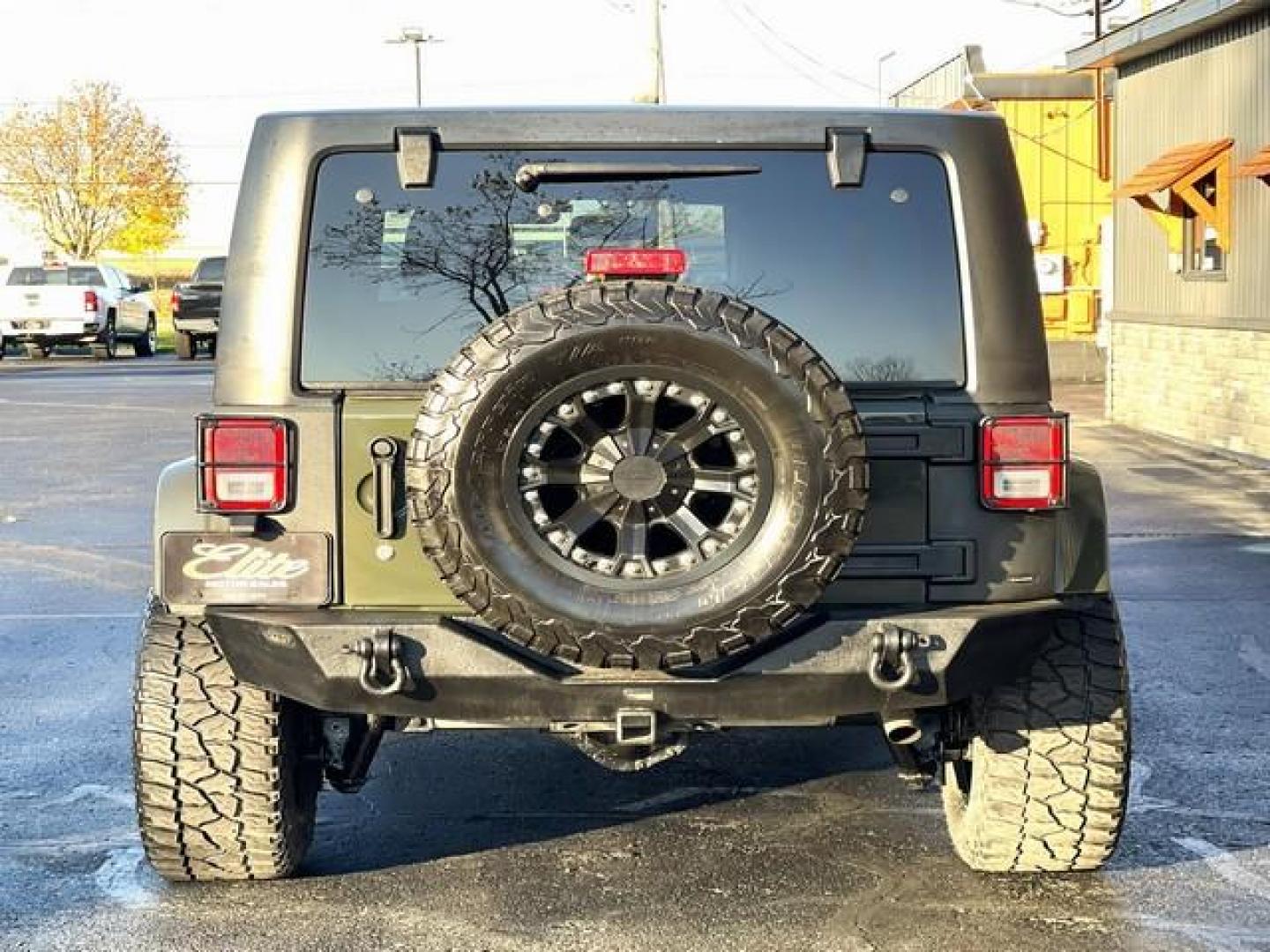 2015 GREEN JEEP WRANGLER (1C4BJWEG4FL) with an V6,3.6L(220 CID),DOHC engine, AUTOMATIC transmission, located at 14600 Frazho Road, Warren, MI, 48089, (586) 776-3400, 42.485996, -82.974220 - Photo#6