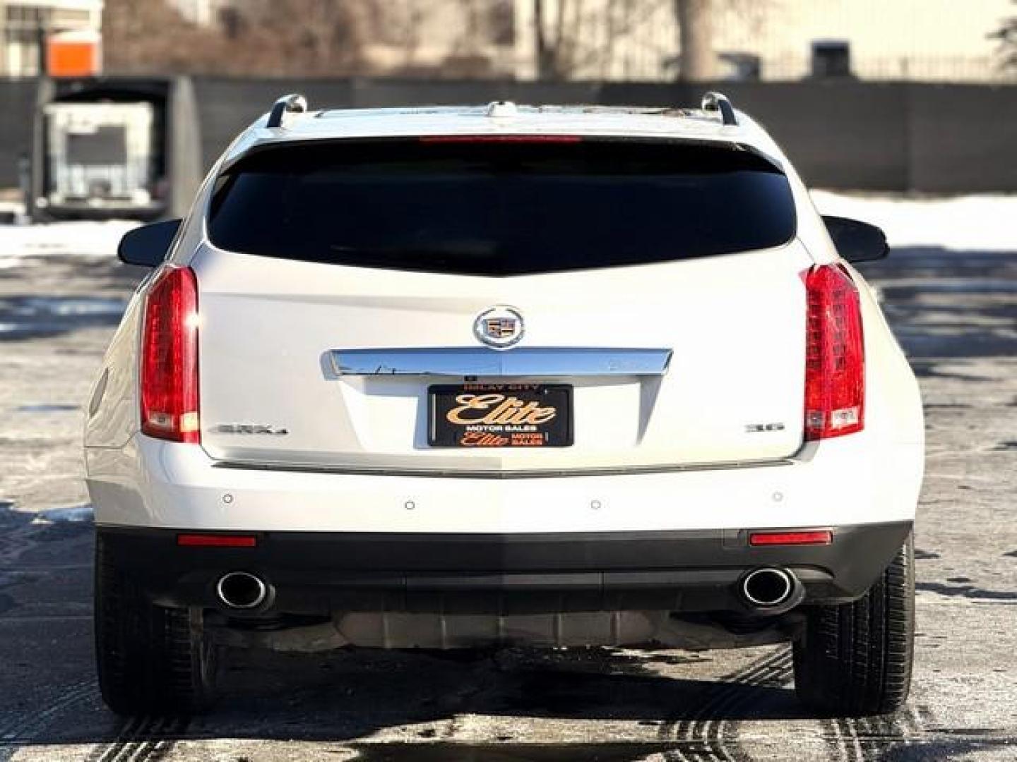 2015 PEARL WHITE CADILLAC SRX (3GYFNFE33FS) with an V6,3.6L(217 CID),DOHC engine, AUTOMATIC transmission, located at 14600 Frazho Road, Warren, MI, 48089, (586) 776-3400, 42.485996, -82.974220 - Photo#6